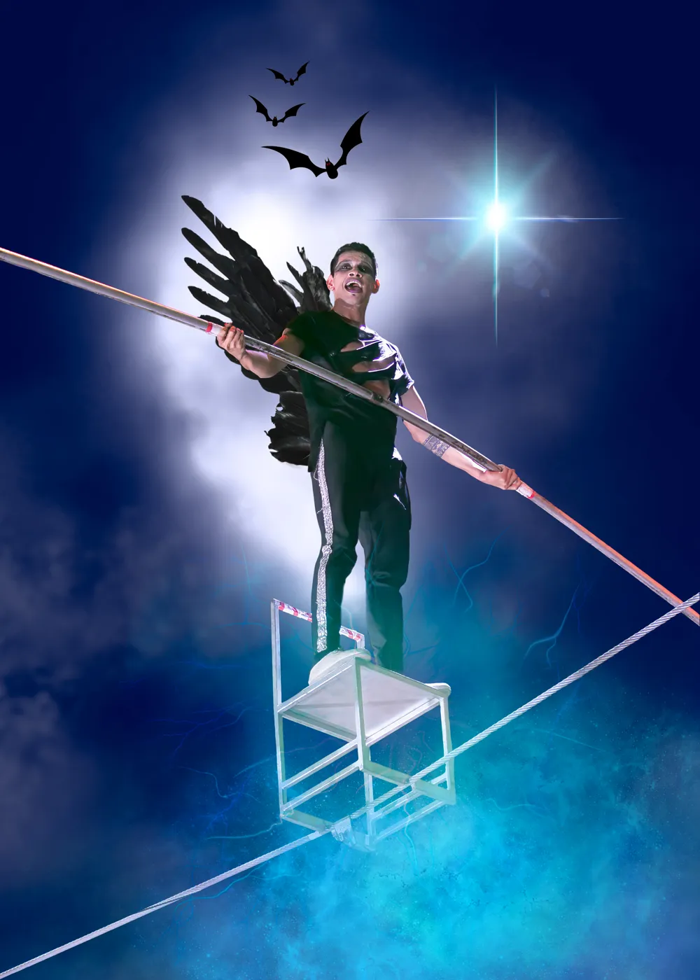 A high-wire walker in a winged costume balancing on a chair on the wire